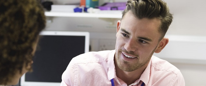 A man talking to another person