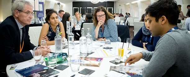 People sat on a table talking