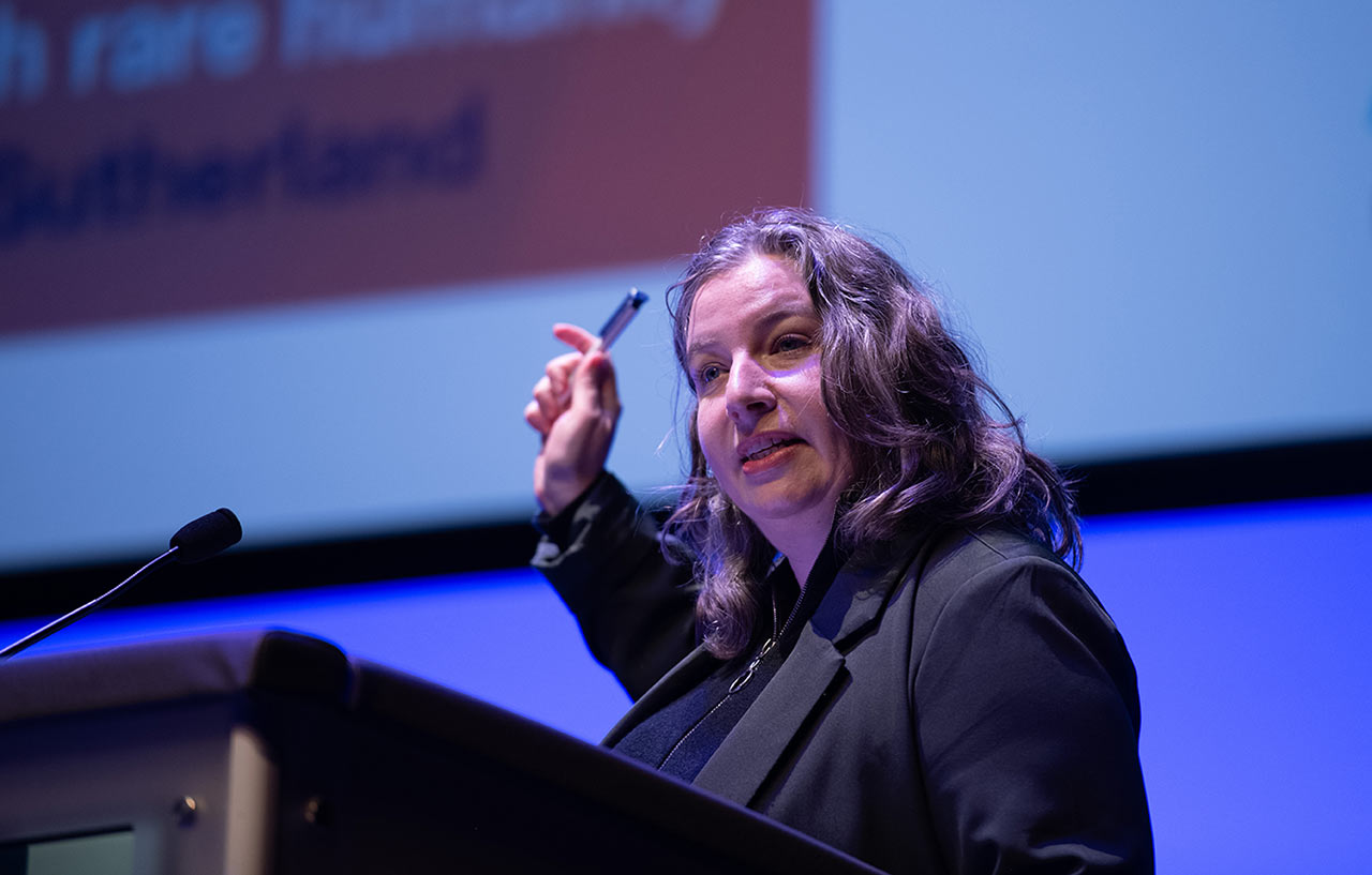 Lucy Easthope speaking at a podium
