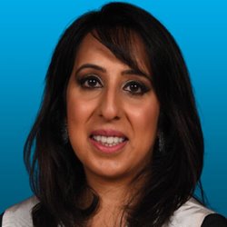 Headshot of Zirva Khan from the shoulders up smiling.