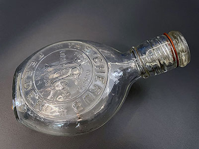Cherub feeder from the RCGP Collection, 1890s. Ornate 1890s infant feeding bottle, known as a "cherub feeder," featuring cherubic figures, used to administer milk or nutrients to infants.