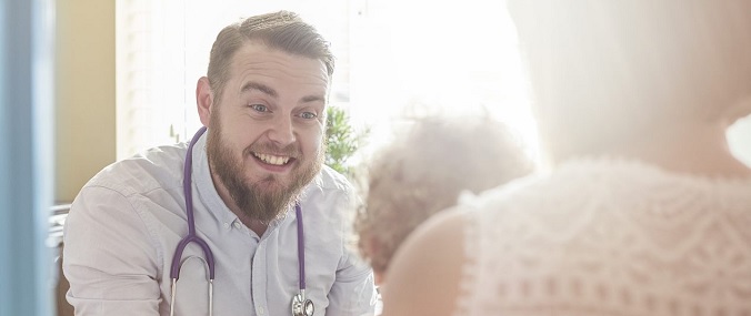 A doctor smiling at a child patient