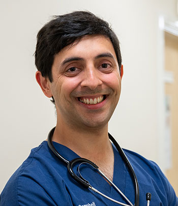 Headshot of Dr Thomas-Patel Campbell
