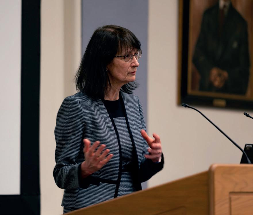 Dame Jenny Harries speaking at a podium