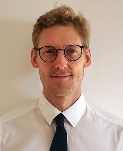 Head shot photo of Dr Munro Stewart