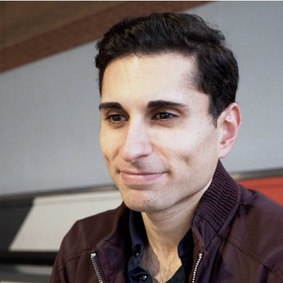 A head and shoulders image of Dr Hussain Al Zubaidi smiling and looking to the side. 