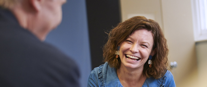 women-laughing-meeting