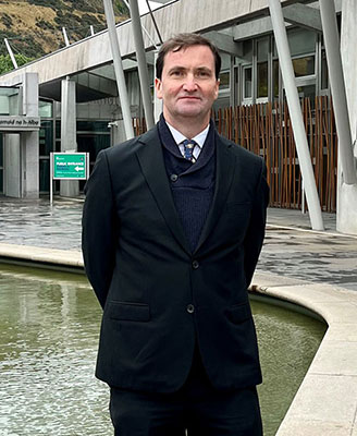 Image of Chris Provan outdoors wearing black coat