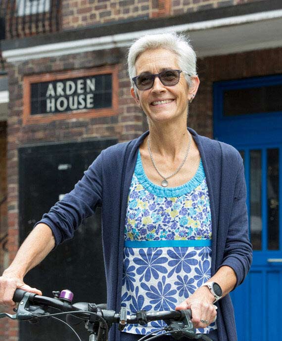 Victoria Holt holding the handlebars of a bike