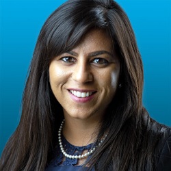 Headshot of Dr Nish Manek from the shoulders up smiling